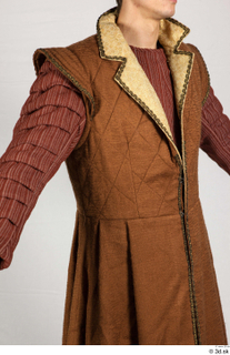  Photos Medieval Servant in suit 5 17th century Historical clothing Historical servant brown jacket red gambeson upper body 0010.jpg